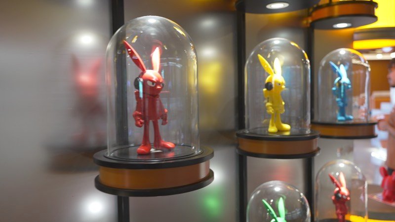 Red bunny figurine in a glass dome