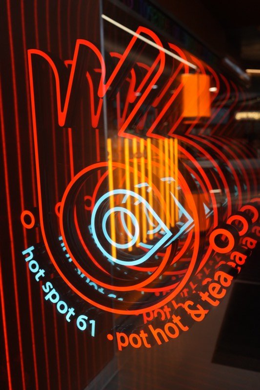 Glowing red and blue Hot Spot 61 neon sign